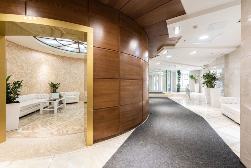 Bright commercial building lobby with clean floors and a fresh, welcoming entrance.